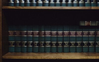 Open law books on a wooden desk representing CLAT counselling decision documents