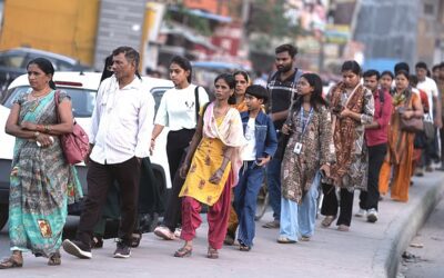 Rural workers in India holding placards demanding employment