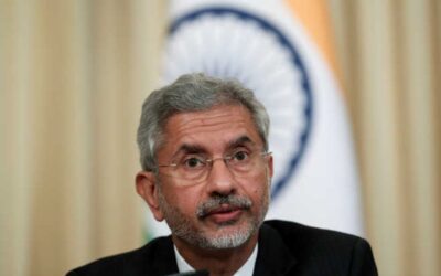 Quad foreign ministers meeting diplomatic flags backdrop