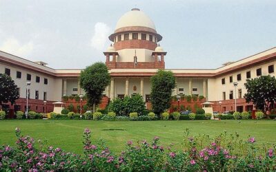 Supreme Court of India building exterior with national flag