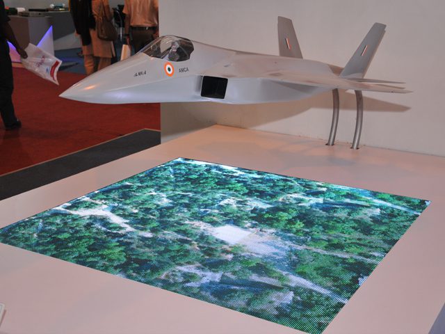Scale model of India's Advanced Medium Combat Aircraft on display at an aerospace exhibition