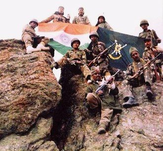 Indian Army soldiers on a captured mountain ridge during the Kargil conflict