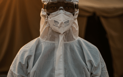 Health workers in protective equipment responding to an Ebola outbreak in Africa
