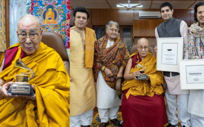 The 14th Dalai Lama receiving the Grammy Award at his Dharamshala residence