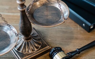 CLAT 2027 registration concept with gavel and scales of justice on a wooden desk