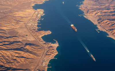 An oil tanker navigating a narrow sea strait representing a global energy chokepoint