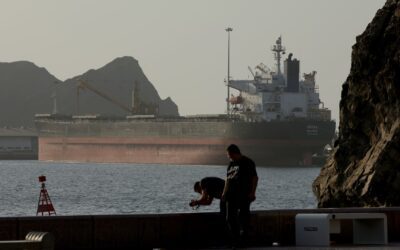 Oil tanker transiting a narrow maritime strait illustrating the Strait of Hormuz chokepoint