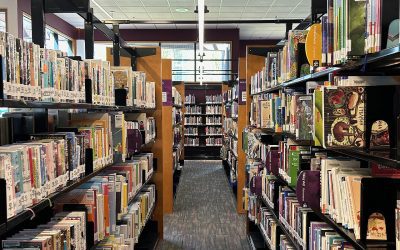 Law entrance exam preparation desk with books and notes for CLAT 2027 notification