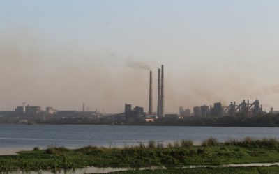 A large steel plant with industrial structures and chimneys