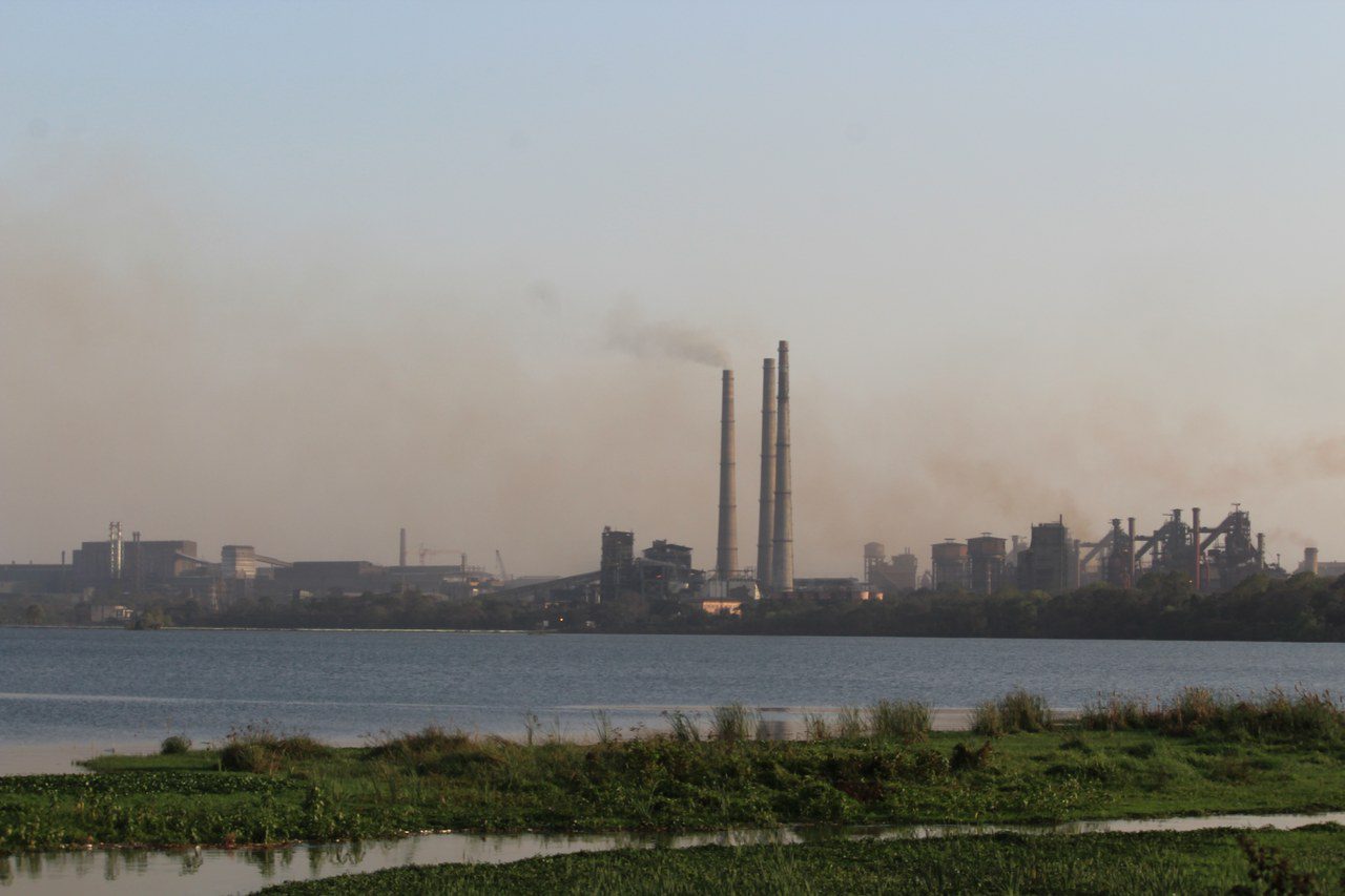 A large steel plant with industrial structures and chimneys