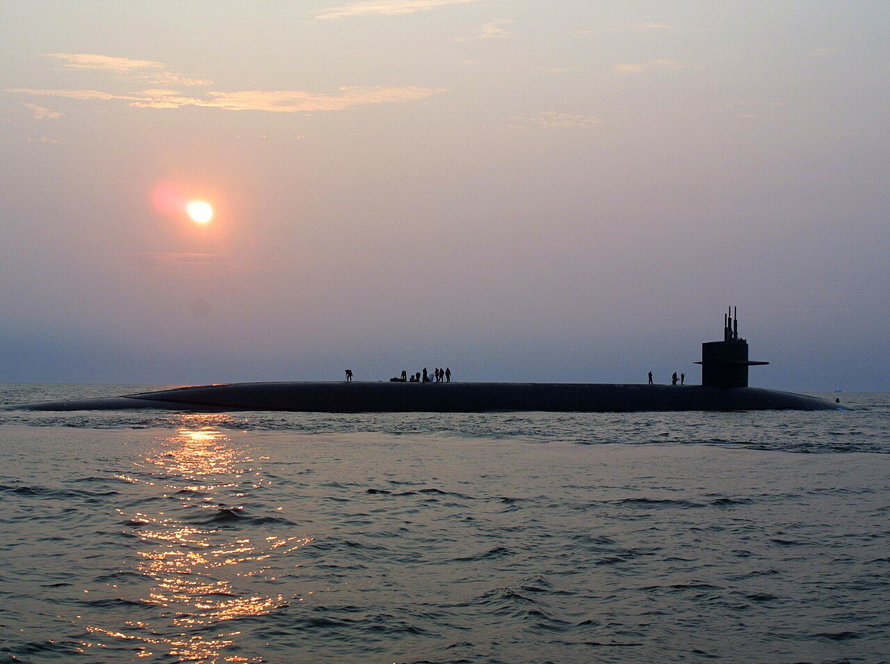 A nuclear-powered ballistic-missile submarine on the surface at sea