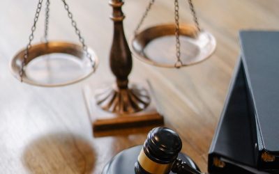 Law books gavel and scales of justice on a wooden desk for CLAT 2027 preparation