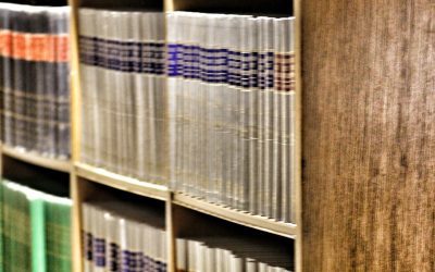 Rows of bound law reports on library shelves