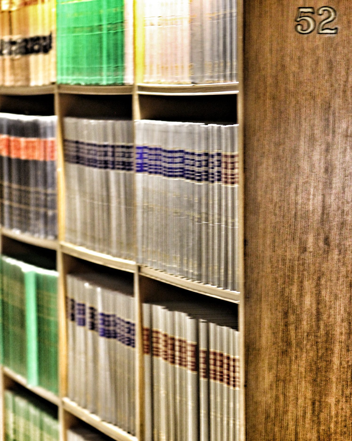Rows of bound law reports on library shelves