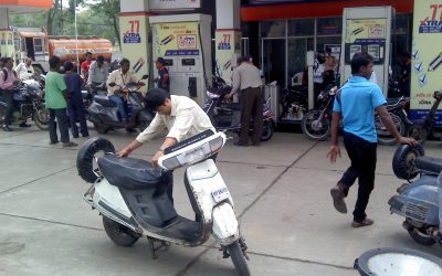 Fuel dispenser at a petrol pump displaying ethanol-blended petrol