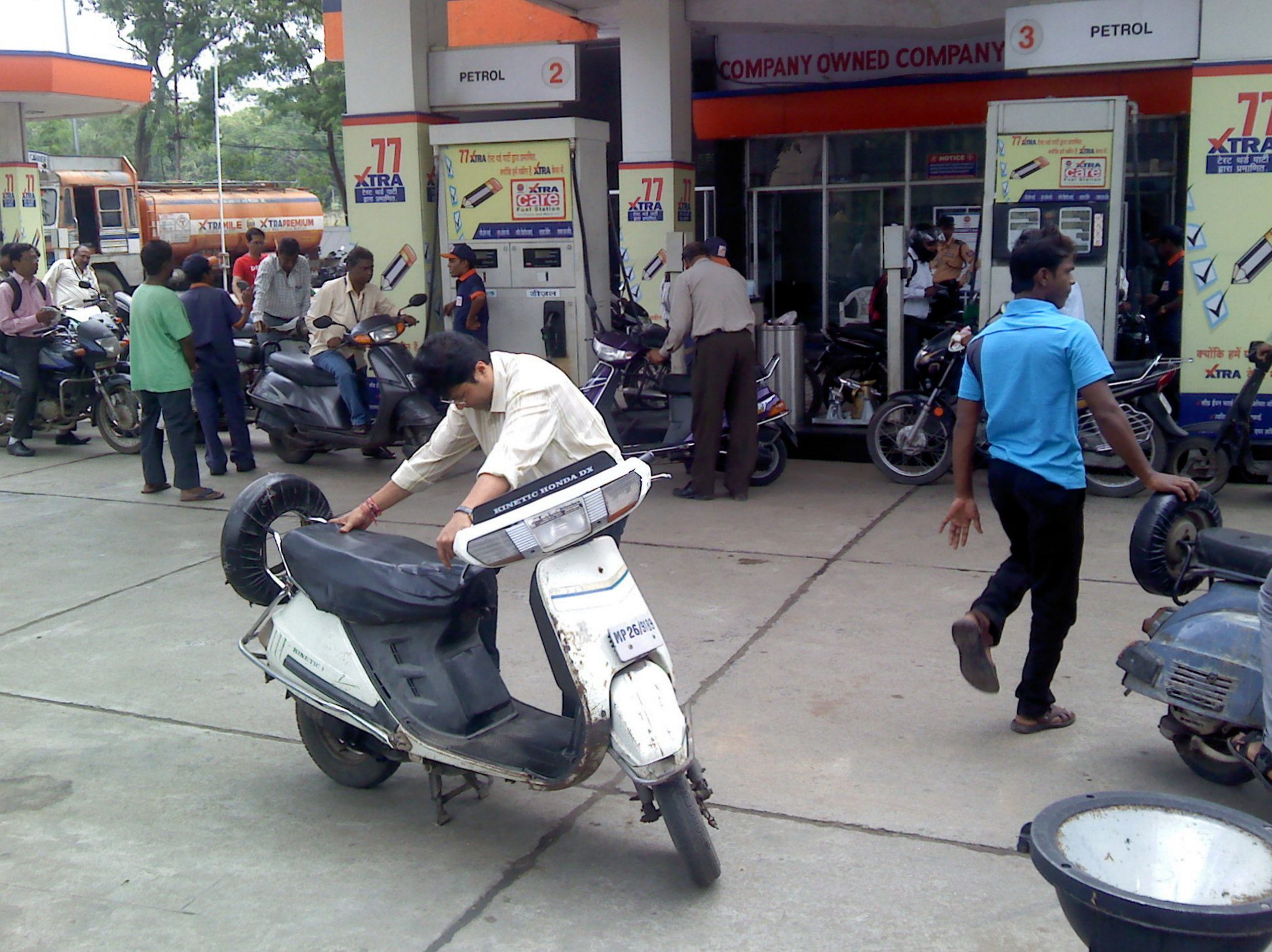 Fuel dispenser at a petrol pump displaying ethanol-blended petrol