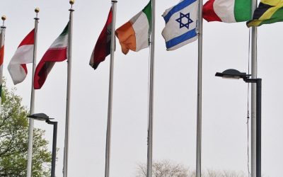 Rows of member-state flags outside the United Nations headquarters