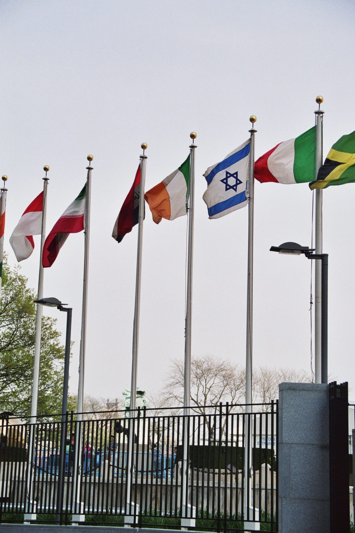 Rows of member-state flags outside the United Nations headquarters