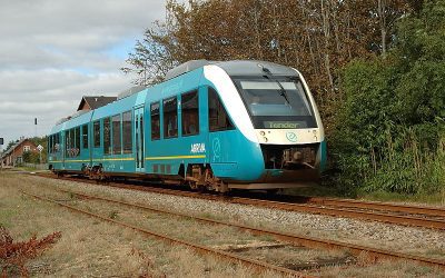 A modern hydrogen fuel-cell passenger train at a station platform