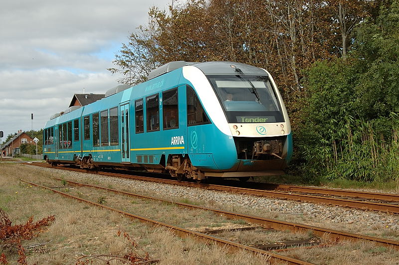 A modern hydrogen fuel-cell passenger train at a station platform