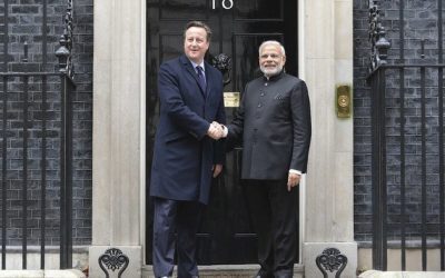 Two national leaders shaking hands during a bilateral meeting
