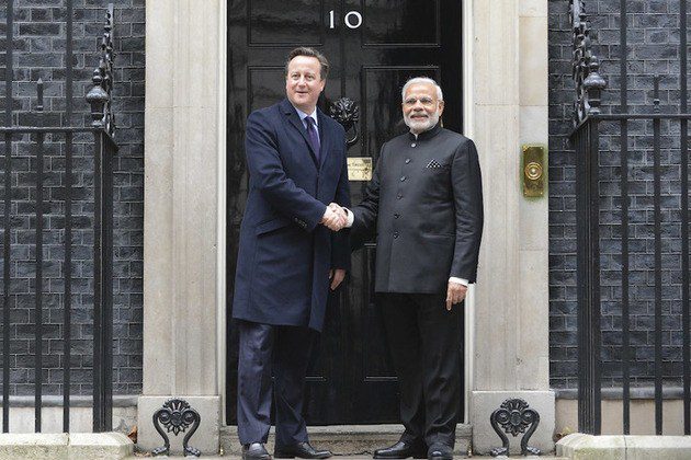 Two national leaders shaking hands during a bilateral meeting