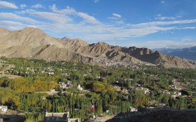 Snow-capped Himalayan mountains overlooking a monastery town in the Ladakh region