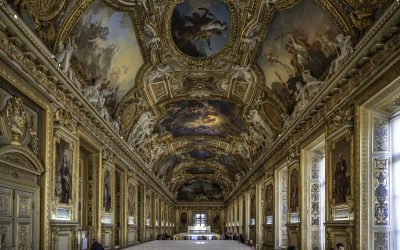 Ornate gilded interior of the Apollo Gallery with its painted ceiling and chandeliers