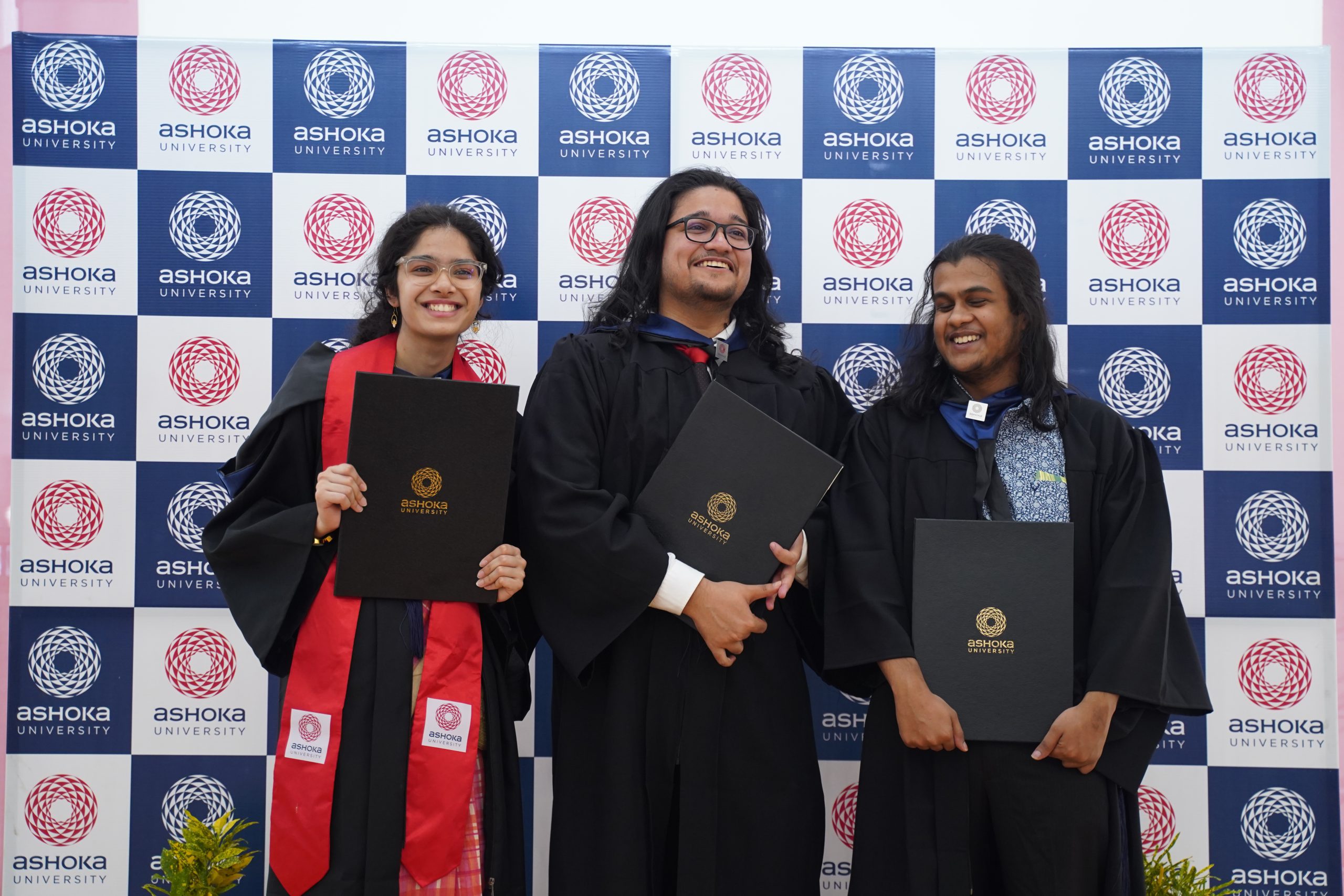 University students in graduation gowns seated at a convocation ceremony