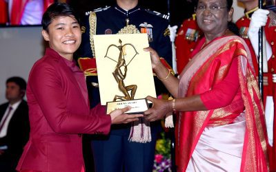 Indian wushu athlete Naorem Roshibina Devi receiving a national sports award