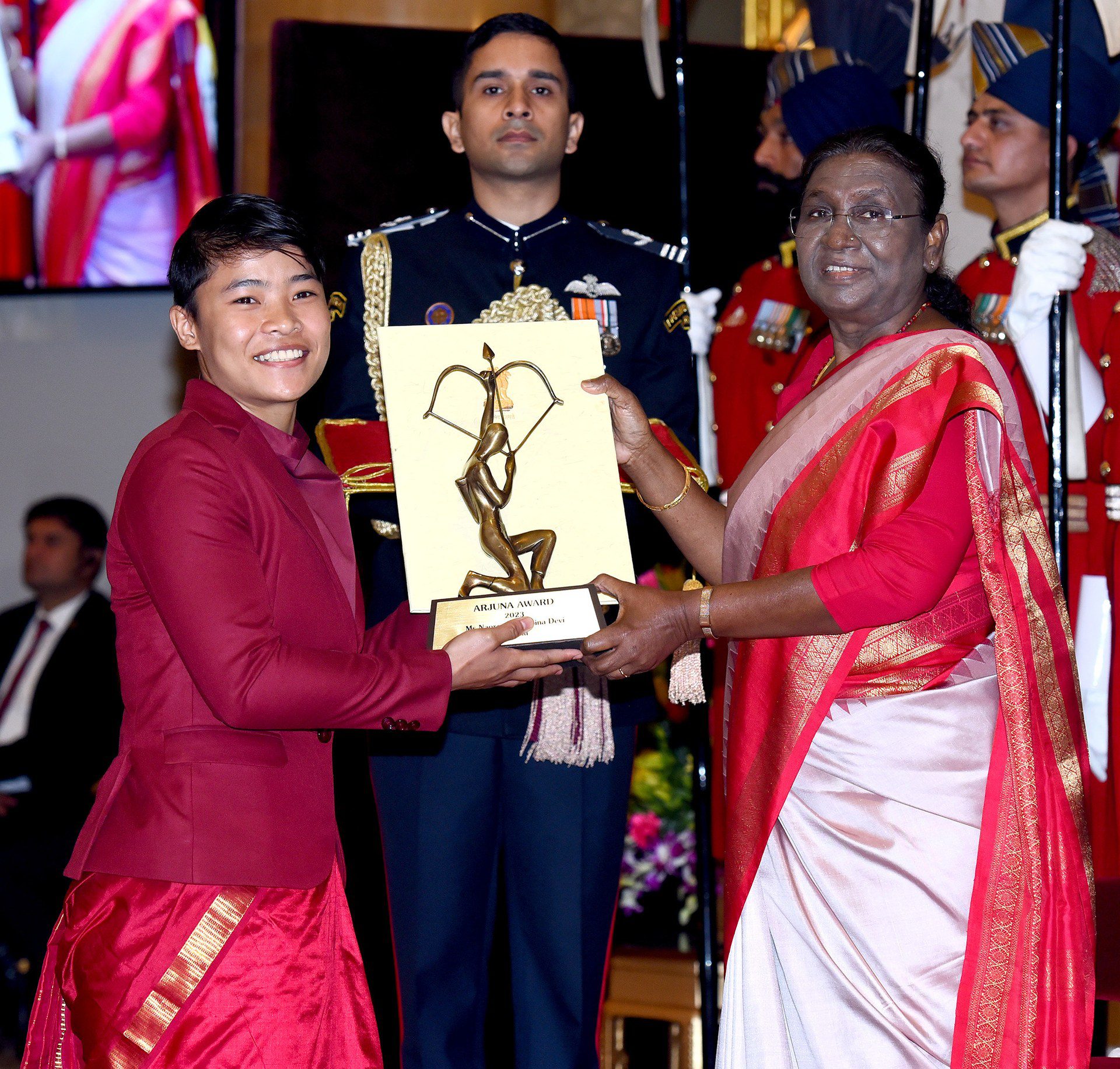 Indian wushu athlete Naorem Roshibina Devi receiving a national sports award