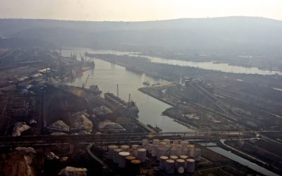 Aerial view of an Indian seaport with docks, cargo berths and breakwaters