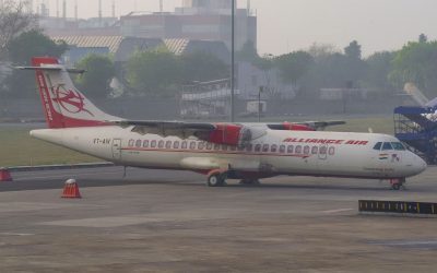 An ATR 72-600 regional turboprop aircraft parked on an airport apron in India
