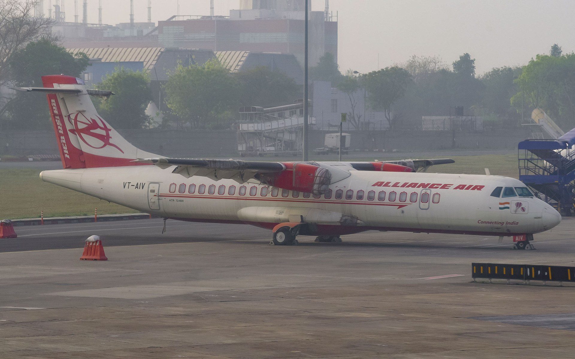 An ATR 72-600 regional turboprop aircraft parked on an airport apron in India