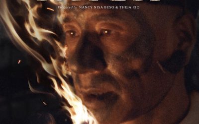 Official poster of the film Angh showing a Konyak elder holding a flaming torch