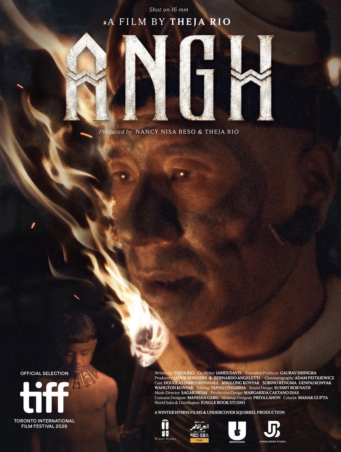 Official poster of the film Angh showing a Konyak elder holding a flaming torch