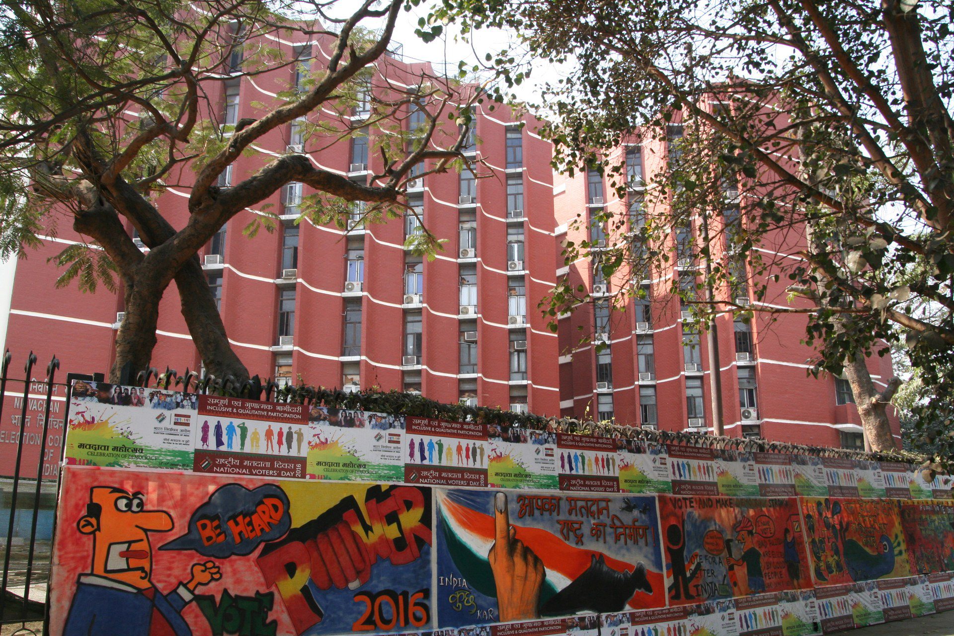 Voter awareness posters and murals on the boundary wall outside the Election Commission headquarters at Nirvachan Sadan, New Delhi