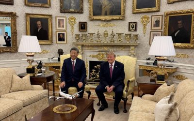US President Donald Trump and Chinese President Xi Jinping seated together in the Oval Office