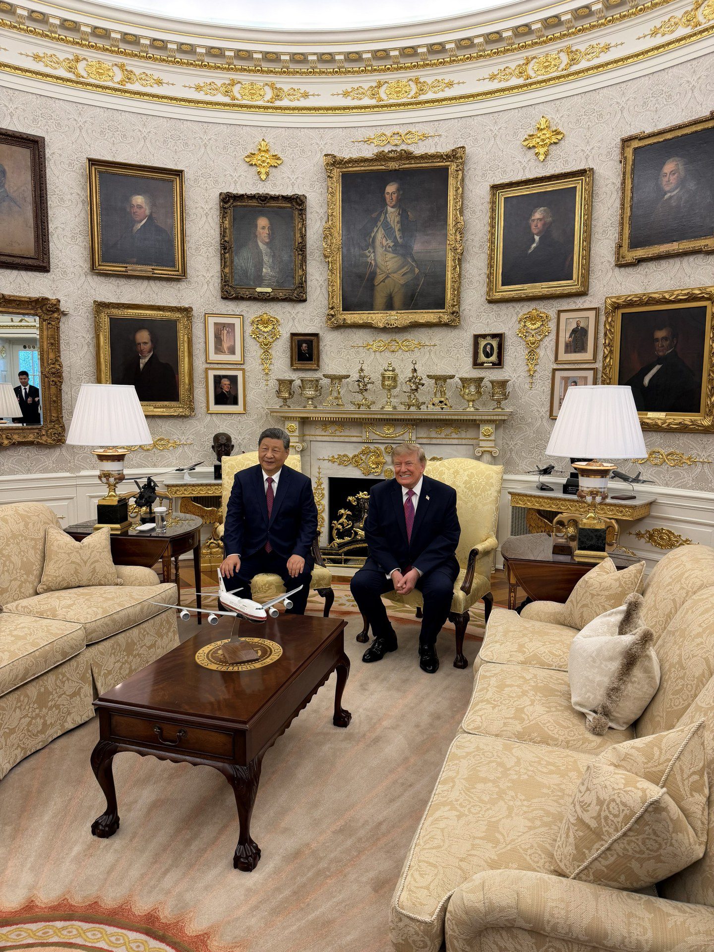 US President Donald Trump and Chinese President Xi Jinping seated together in the Oval Office