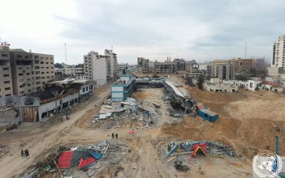Aerial view of a heavily damaged school compound amid ruined buildings in Gaza City