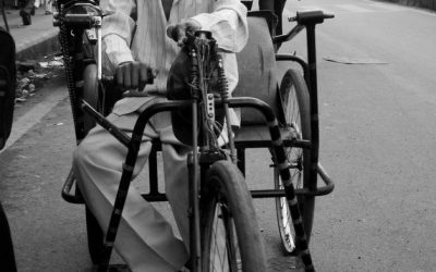 Hand-pedalled tricycle used by a person with a disability at an assistance camp in India