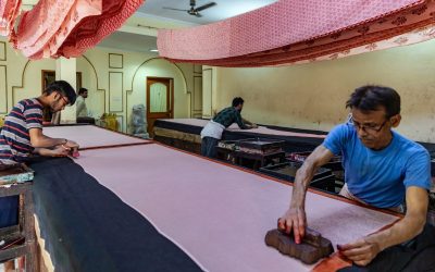 Workers block-printing fabric at a textile workshop in Jaipur (representative image of the formal workforce)