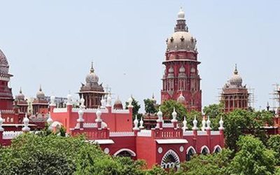 Red Indo-Saracenic domes and towers of the Madras High Court building in Chennai