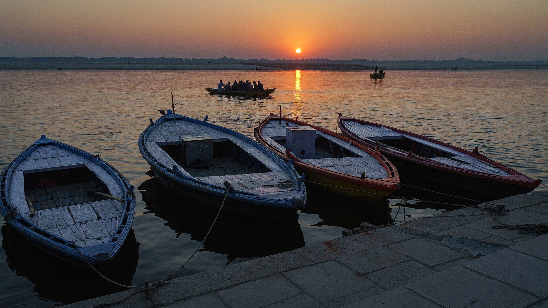 Boats on the Ganga river at sunrise in Varanasi