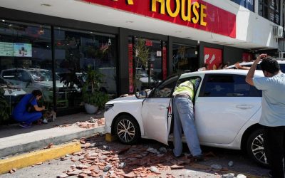A car damaged by falling debris in Panama City after the earthquake of 9 October 2026