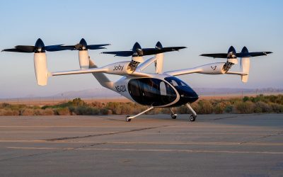 Experimental electric vertical take-off aircraft parked on an airfield