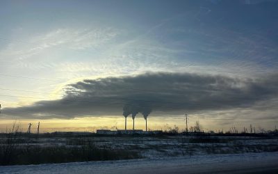 Smoke from a coal-fired power plant drifting across the sun